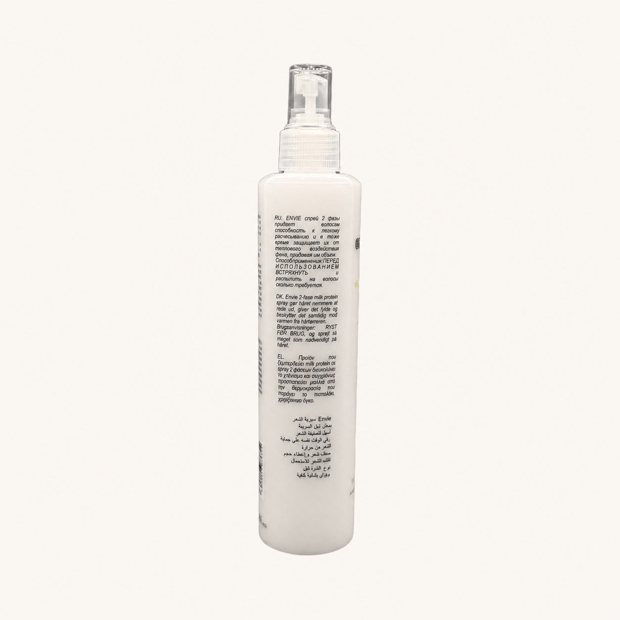 Envie Milk Districante Bifasico — flacone spray su fondo crema