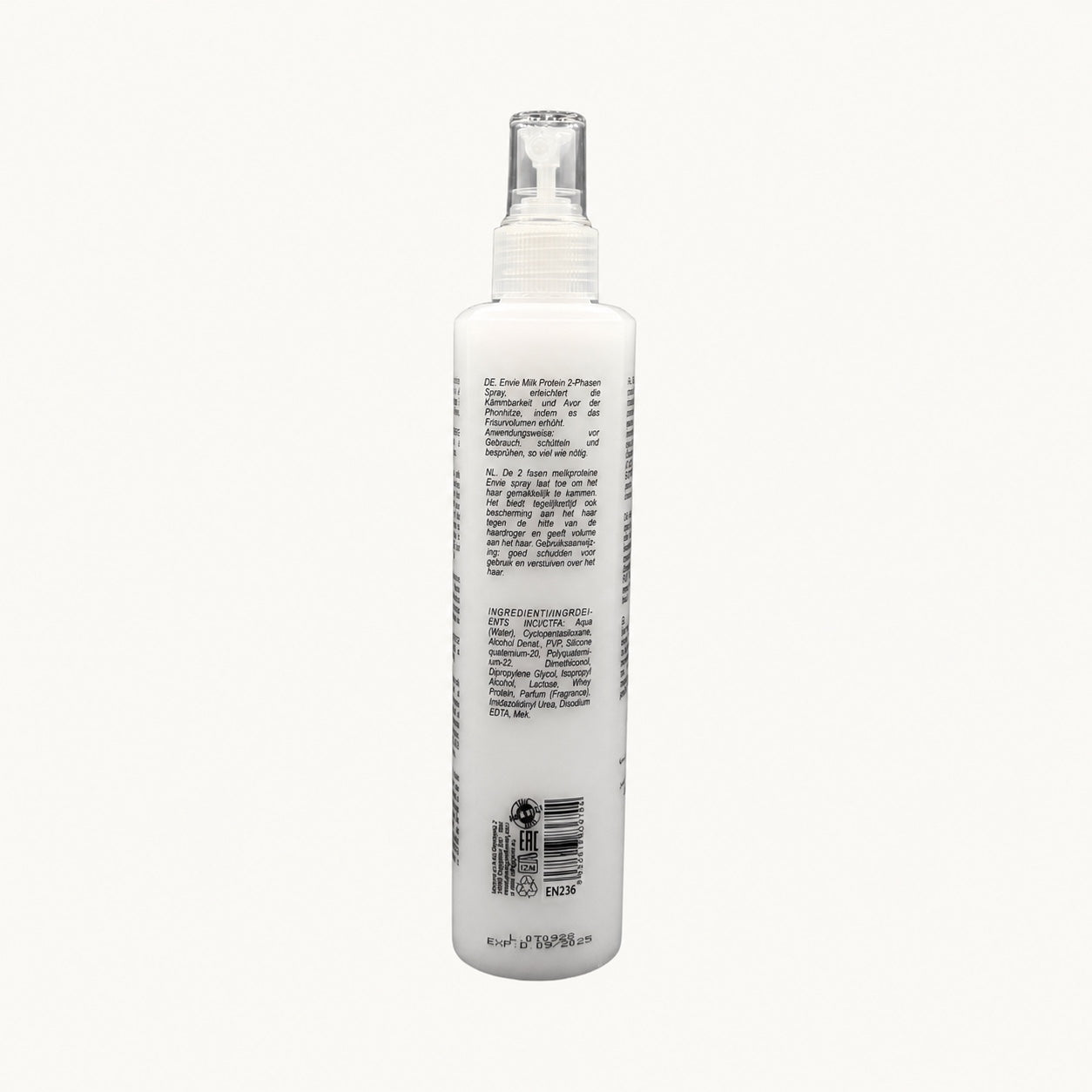 Envie Milk Districante Bifasico — flacone spray su fondo crema