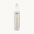 Envie Milk Districante Bifasico — flacone spray su fondo crema